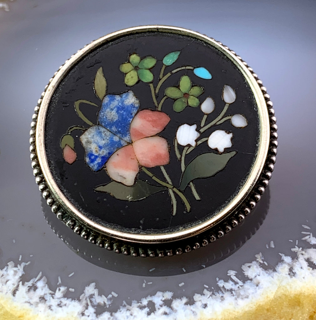 A late 19th century pietra dura brooch. The replacement oval-shape floral pietra dura panel, within for sale at auction from 25th January to 25th January A late 19th century pietra dura brooch. The replacement oval-shape floral pietra dura panel, within for sale at auction from 25th January to 25th January